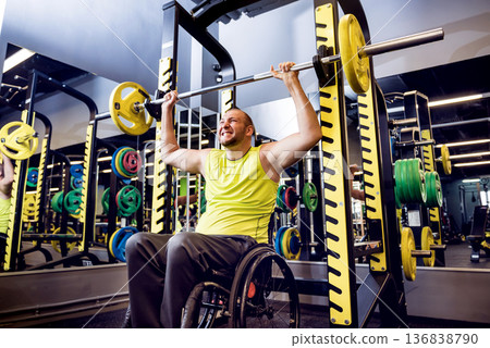 Disabled man training in the gym of rehabilitation center Disabled man training in the gym of rehabilitation center 136838790