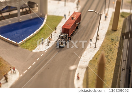 Miniature World Truck Transports Cargo on Road Near River and Pedestrians, Detailed Model Miniature World Truck Transports Cargo on Road Near River and Pedestrians, Detailed Model 136839092