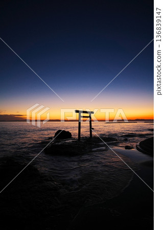 Chita Peninsula in autumn: The Tsubutegaura Torii gate stands against the backdrop of a sunset-colored sky 136839147