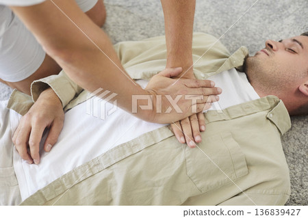 CPR, cardiopulmonary resuscitation and emergency help in breathing for lying man CPR, cardiopulmonary resuscitation and emergency help in breathing for lying man 136839427