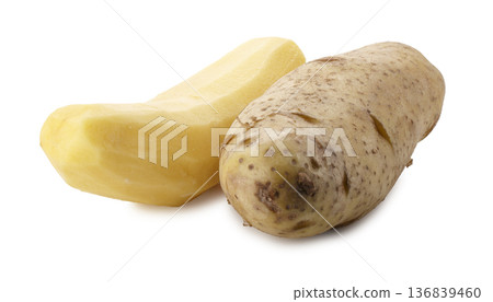 Whole raw potatoes and peeled raw potatoes isolated on a white background Whole raw potatoes and peeled raw potatoes isolated on a white background 136839460