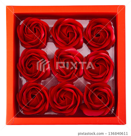 Red rose blossom in red box isolated on white background. 136840611