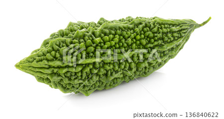 Fresh bitter gourd Bitter cucumber or bitter melon with cut slice isolated on a white background. Fresh bitter gourd Bitter cucumber or bitter melon with cut slice isolated on a white background. 136840622