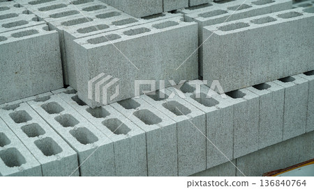 Stacked Cement Blocks with Holes for Construction 136840764