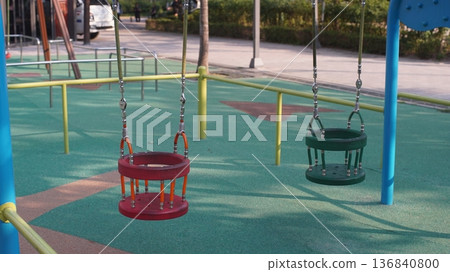 Toddler swing at public park playground 136840800