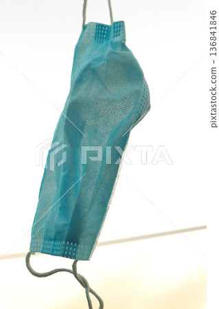 Disposable Face Mask Hanging on a Clothesline Disposable Face Mask Hanging on a Clothesline 136841846