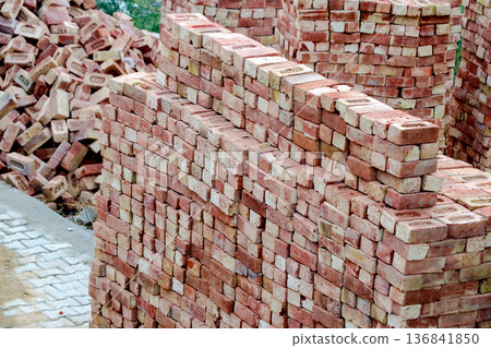 Stacked Red Bricks at Construction Site Stacked Red Bricks at Construction Site 136841850