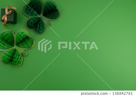 Beautiful table setting for St. Patricks Day celebration on green background Beautiful table setting for St. Patricks Day celebration on green background 136842781