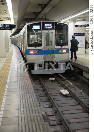 Conductor preparing for departure at Odakyu Line Shinjuku Station Conductor preparing for departure at Odakyu Line Shinjuku Station 136843232