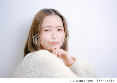 A Japanese woman in her twenties turning around on a white background A Japanese woman in her twenties turning around on a white background 136843517