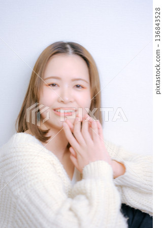 A Japanese woman in her twenties turning around on a white background A Japanese woman in her twenties turning around on a white background 136843528