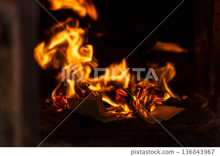 The instant the paper money burned fiercely inside the incense burner The instant the paper money burned fiercely inside the incense burner 136843967