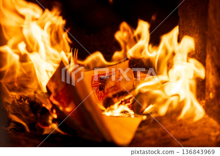 The instant the paper money burned fiercely inside the incense burner The instant the paper money burned fiercely inside the incense burner 136843969