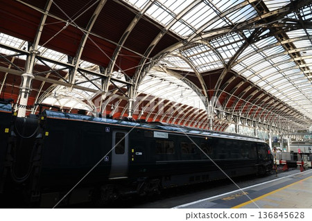 London Paddington Station and a train stopping there 136845628