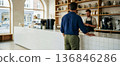 barista prepares coffee for a waiting customer, a copy space with the interior of a favorite cafe, a coffee shop concept with copy space for text 136846286