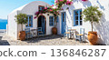 poster with a view of a cafe in an old house on a Greek island, promoting tourist routes and advertising popular coffee shops 136846287
