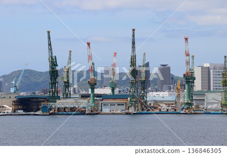 Kawasaki Heavy Industries, Ltd. Kobe Plant viewed from the sidewalk of Kobe Bridge 136846305