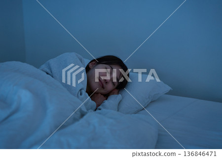 Woman sleeping peacefully 136846471