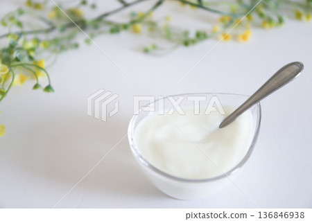 Yogurt in a glass container. Breakfast image on white background. Yogurt in a glass container. Breakfast image on white background. 136846938
