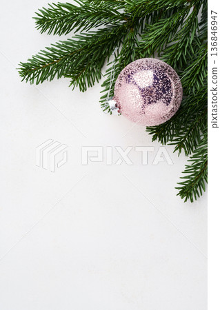 Christmas fir branch with pink ball Christmas fir branch with pink ball 136846947