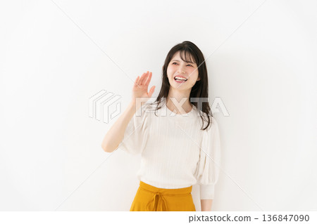 Middle-aged woman portrait waving 136847090