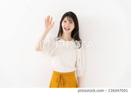 Middle-aged woman portrait waving 136847091