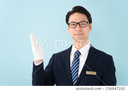 Businessman with white gloves holding hands Businessman with white gloves holding hands 136847282