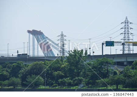 [Sakai City] Close-up of a gigantic crane ship and viaduct floating on the canal, and materials on heavy infrastructure and heavy machinery 136847443