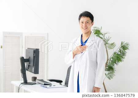 Medical man in white coat 136847579