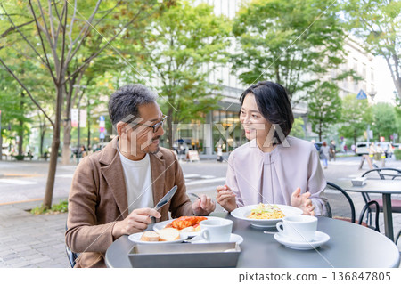 Couple having lunch on the terrace Couple having lunch on the terrace 136847805