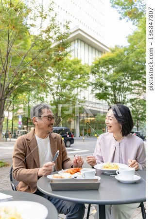 Couple having lunch on the terrace Couple having lunch on the terrace 136847807