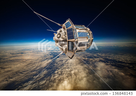 Detailed view of a satellite in space, featuring metallic structure, antennas, and large solar panels, orbiting above Earth's blue atmosphere and orange-tinted cloud layers against the dark void. Detailed view of a satellite in space, featuring metallic structure, antennas, and large solar panels, orbiting above Earth's blue atmosphere and orange-tinted cloud layers against the dark void. 136848143