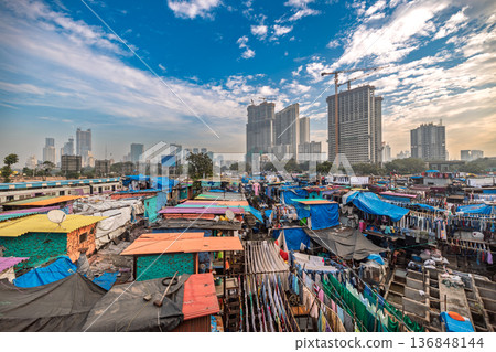 Contrast of Mumbai skyscrapers and Dhobi Ghat laundry. Contrast of Mumbai skyscrapers and Dhobi Ghat laundry. 136848144