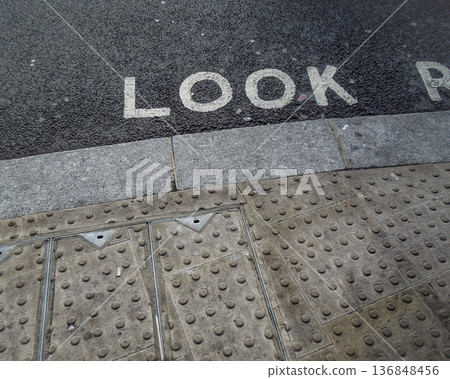 "LOOK" crosswalk sign painted on a London road "LOOK" crosswalk sign painted on a London road 136848456