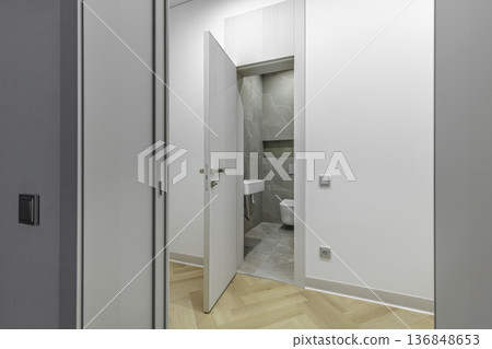 View into Modern Bathroom Through Open White Interior Door 136848653