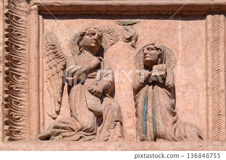 Annunciation to the Virgin Mary, relief on Facade of Sant`Anastasia Church in Verona, Italy Annunciation to the Virgin Mary, relief on Facade of Sant`Anastasia Church in Verona, Italy 136848755