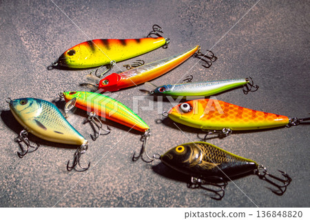 Colorful fishing lures and bobbers arranged on a table ready for successful fishing trip 136848820