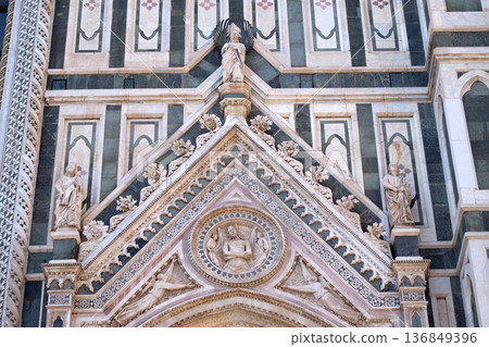 Wrapping Christ in his shroud, Portal on the side-wall of Cattedrale di Santa Maria del Fiore (Cathedral of Saint Mary of the Flower), Florence, Italy Wrapping Christ in his shroud, Portal on the side-wall of Cattedrale di Santa Maria del Fiore (Cathedral of Saint Mary of the Flower), Florence, Italy 136849396
