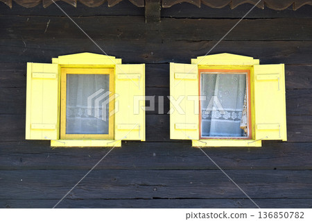 Windows on typical wooden house in the village Krapje, Lonjsko Polje Nature park, Croatia 136850782