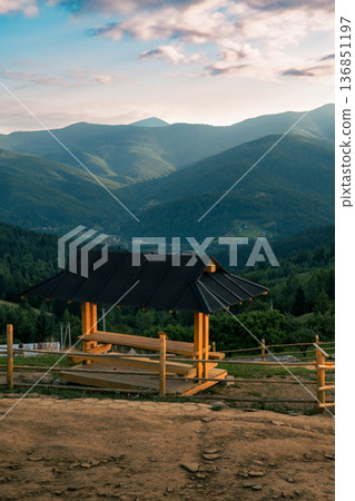 Wooden Mountain Shelter Overlooking Green Valley Wooden Mountain Shelter Overlooking Green Valley 136851197