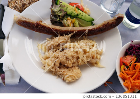 Sausage with cabbage, highway restaurant in Pentling, Germany Sausage with cabbage, highway restaurant in Pentling, Germany 136851311