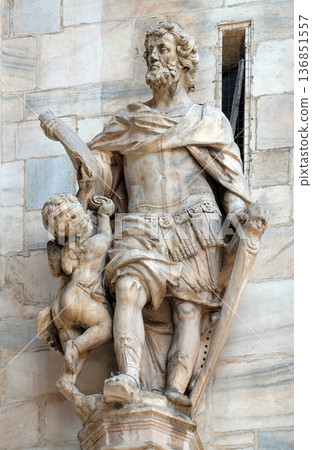 Statue of Saint on the facade of the Milan Cathedral, Duomo di Santa Maria Nascente, Milan, Lombardy, Italy Statue of Saint on the facade of the Milan Cathedral, Duomo di Santa Maria Nascente, Milan, Lombardy, Italy 136851557