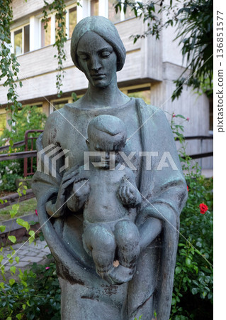 Virgin Mary with baby Jesus statue in the garden of the Blind Center Saint Raphael in Bolzano, Italy Virgin Mary with baby Jesus statue in the garden of the Blind Center Saint Raphael in Bolzano, Italy 136851577