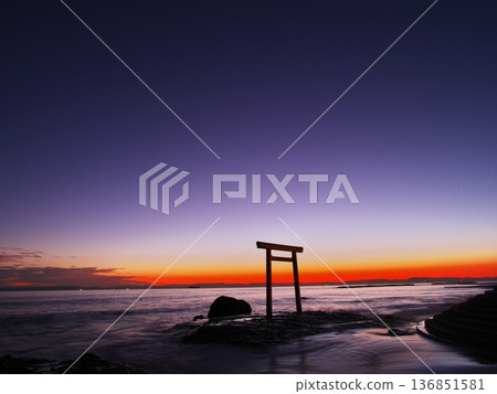 Chita Peninsula in autumn: The Tsubutegaura Torii gate stands against the backdrop of a sunset-colored sky 136851581