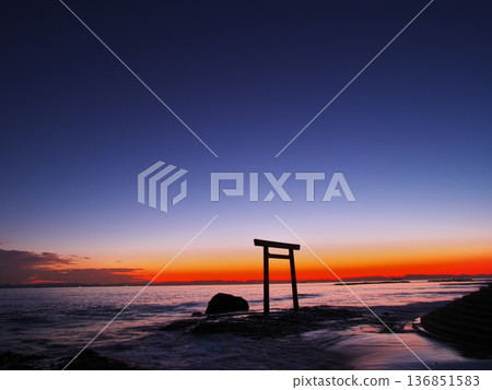 Chita Peninsula in autumn: The Tsubutegaura Torii gate stands against the backdrop of a sunset-colored sky 136851583