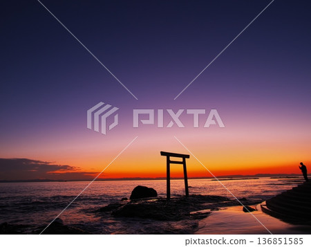 Chita Peninsula in autumn: The Tsubutegaura Torii gate stands against the backdrop of a sunset-colored sky 136851585