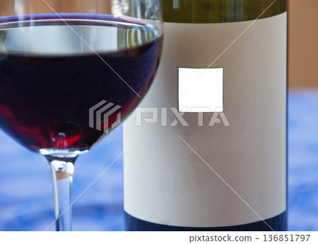 Bottle and wine glass with red wine Bottle and wine glass with red wine 136851797