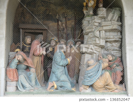 Jesus on the Mount of Olives, surrounded by approaching soldiers and the Apostles, portal of the church of St. Leodegar in Lucerne, Switzerland Jesus on the Mount of Olives, surrounded by approaching soldiers and the Apostles, portal of the church of St. Leodegar in Lucerne, Switzerland 136852047