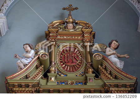 IHS sign on the altar in the Basilica of the Sacred Heart of Jesus in Zagreb, Croatia 136852209