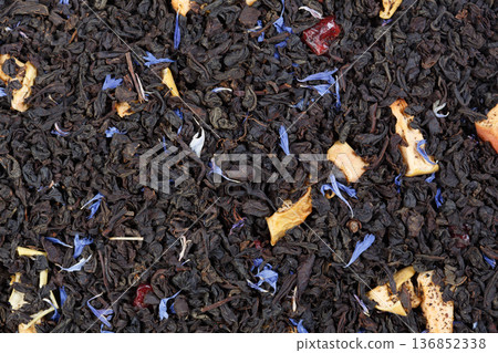 Dry green tea with slices of orange-peels and a bergamot. Can be used as background. 136852338